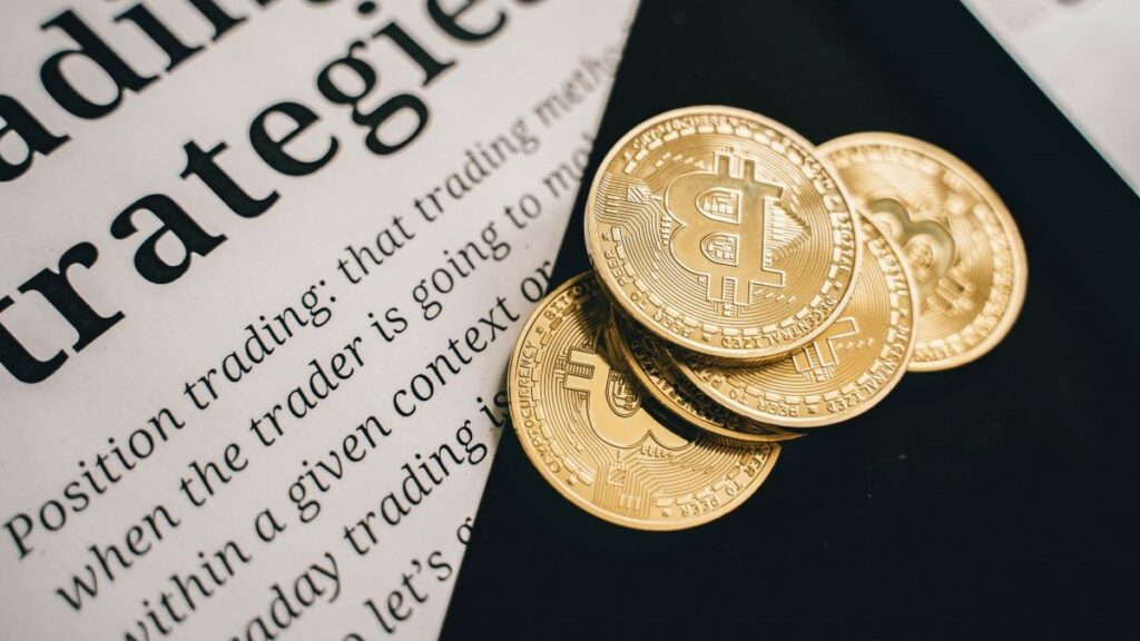 bitcoin news represented by several bitcoins resting on a newspaper article