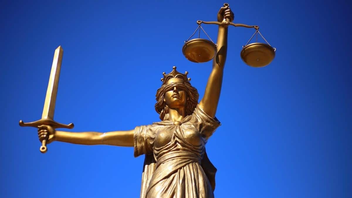 personal injury law represented by a photo of a bronze statue of lady justice against a sky blue background